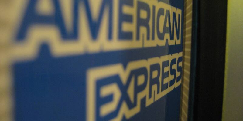 Close-up of a blue American Express logo sign