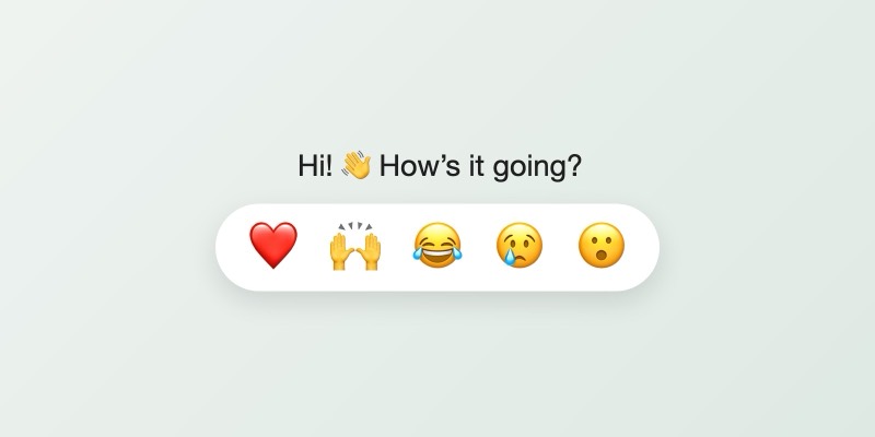 A chat reply reading “Hi! How’s it going?” with a waving hand emoji, above a white bar of five emoji reactions: a red heart, raised hands, laughing with tears, crying and surprised