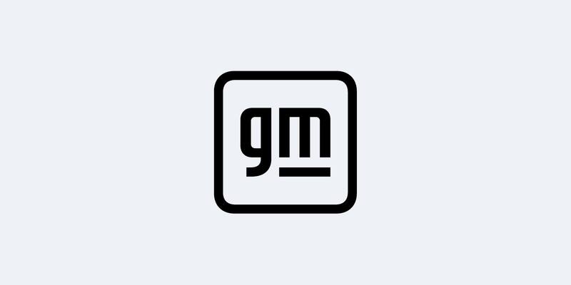 General Motors’ black logo: the lowercase letters gm with an underline inside a rounded square outline, on a pale grey background