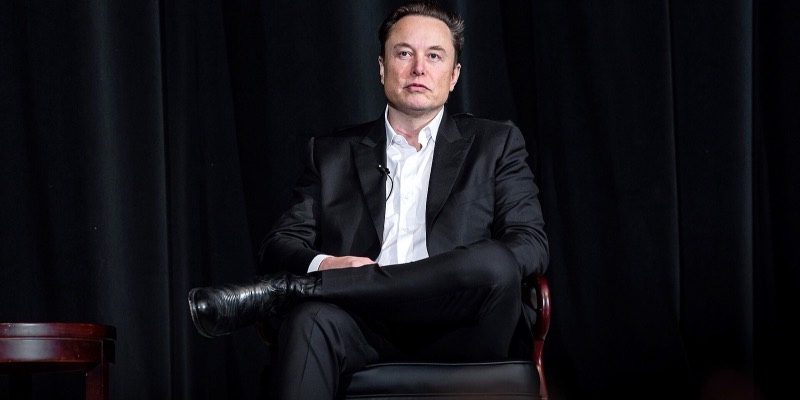Elon Musk speaking on stage at the US Air Force Academy