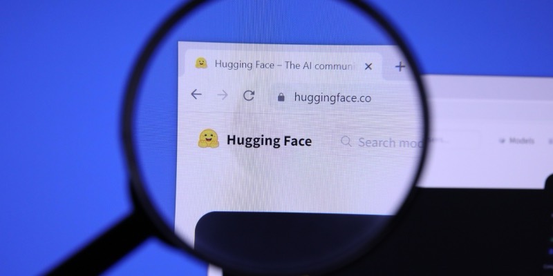A magnifying glass over the Hugging Face website, showing its smiling hugging-face logo and the huggingface.co address