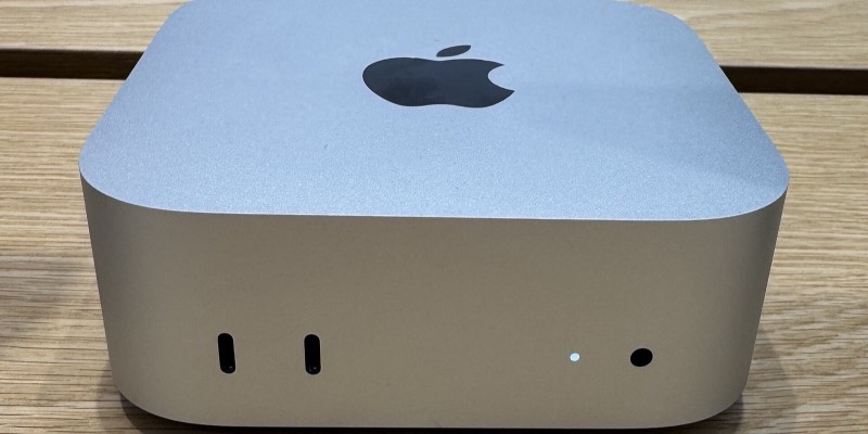 An Apple Mac mini computer on a desk