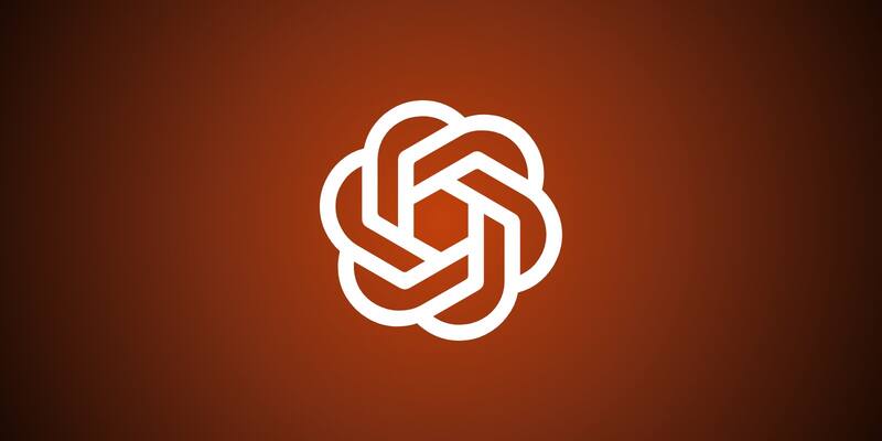 The white OpenAI knot logo centred on a dark amber-to-black background.