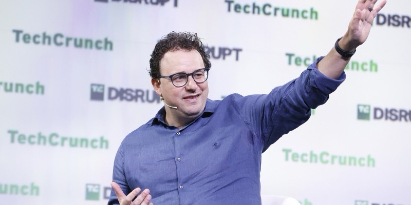 Dario Amodei gesturing on stage at TechCrunch Disrupt